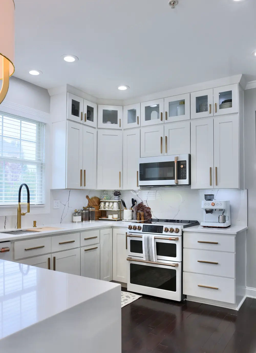 White Shaker galley kitchen with stainless range - RTA Cabinets Canada
